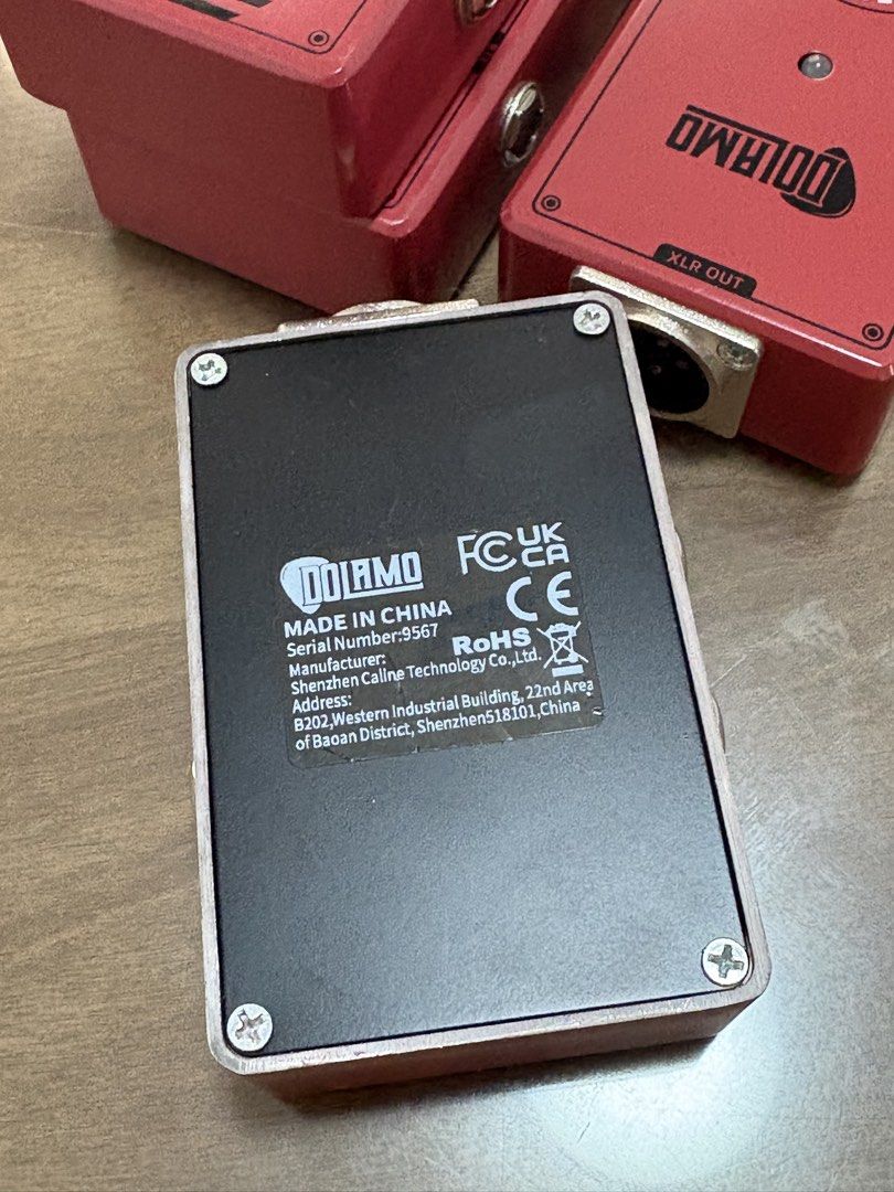 Dolamo Professional Di Red Audio Direct Injection Box (Category: Musical Instruments) located in Santa Rosa. Submitted by carl.case (Listing ID 1470238820, Image 2). Description: - Product: Red Dolamo Professional DI Box for instruments - Condition/Build: Solid metal casing with a clean matte red finish - Connectivity: XLR out, line out, parallel out, and 9V DC power input on the side - Manufacturer: Shenzhen Caline Technology (Model: 9567) - Ide