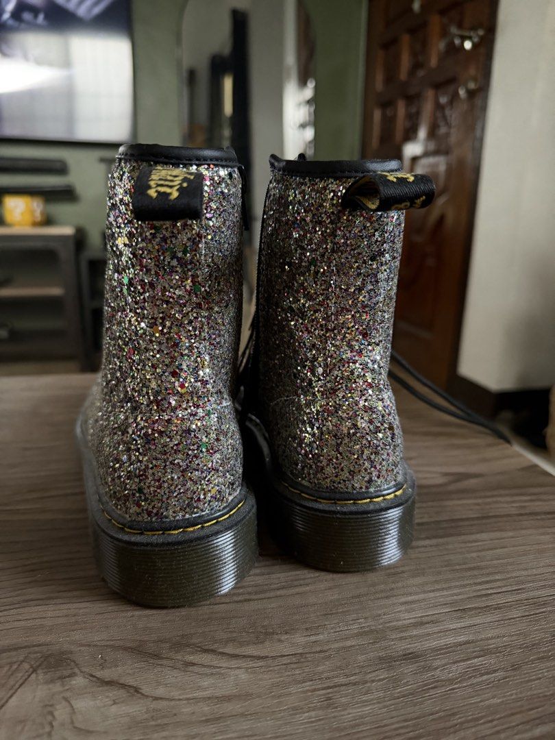 Dr. Martens 1460 Glitter Boots (Category: Boots) located in Las Pinas. Submitted by camskiii (Listing ID 1470226461, Image 3). Description: - Brand: Dr. Martens 1460 - Color: Multicolour Glitter - Size: UK 5 / US M 6 / US L 7 / EU 38 - Condition: Brand new with tags, zero wear on soles - Features: 8-eyelet lace-up, black laces, iconic yellow welt stitching, air-cushioned rubber sole - Origin: Made in China.
