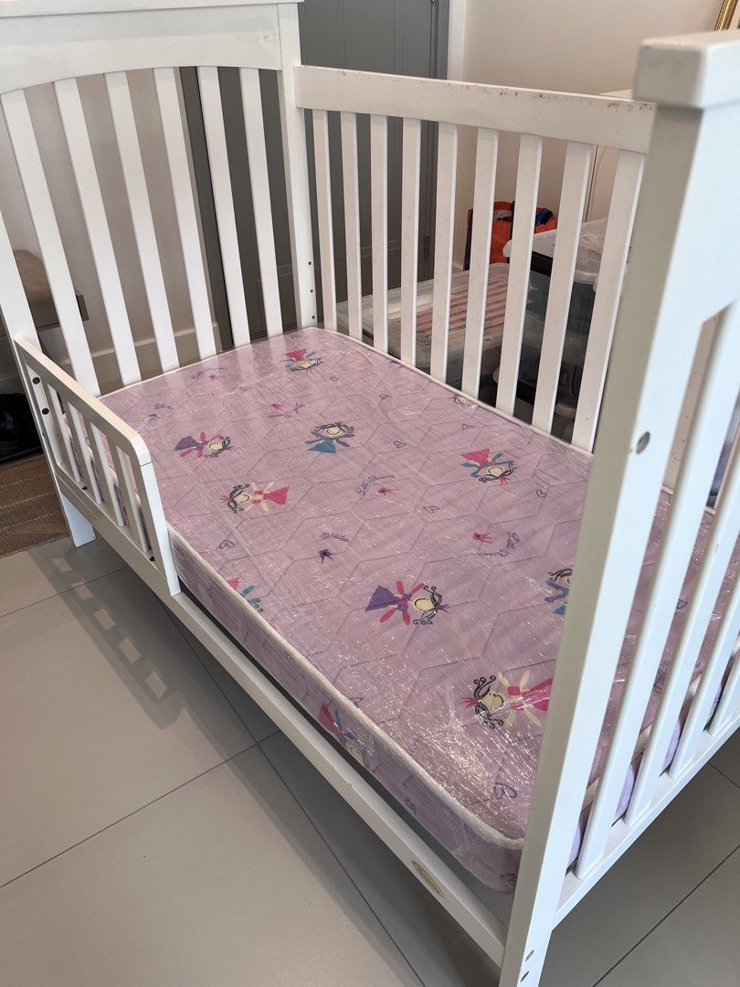Dwelling 2in1 Wooden Crib (Category: Cots & Cribs) located in Muntinlupa City. Submitted by thriftpandamnl (Listing ID 1467424602, Image 3). Description: Selling our baby crib (bought from Baby Company) 🏷️ P3,000 ✔️Size 54in L x 31in W x 43in H ✔️Adjustable height ✔️Convertible to toddler bed ✔️No issues ✔️Sobrang ganda pa nito. Nilisan namin na parang 2nd baby namin ang gagamit ❤️ 📍Pick up location: Brgy Sucat, Muntinlupa.