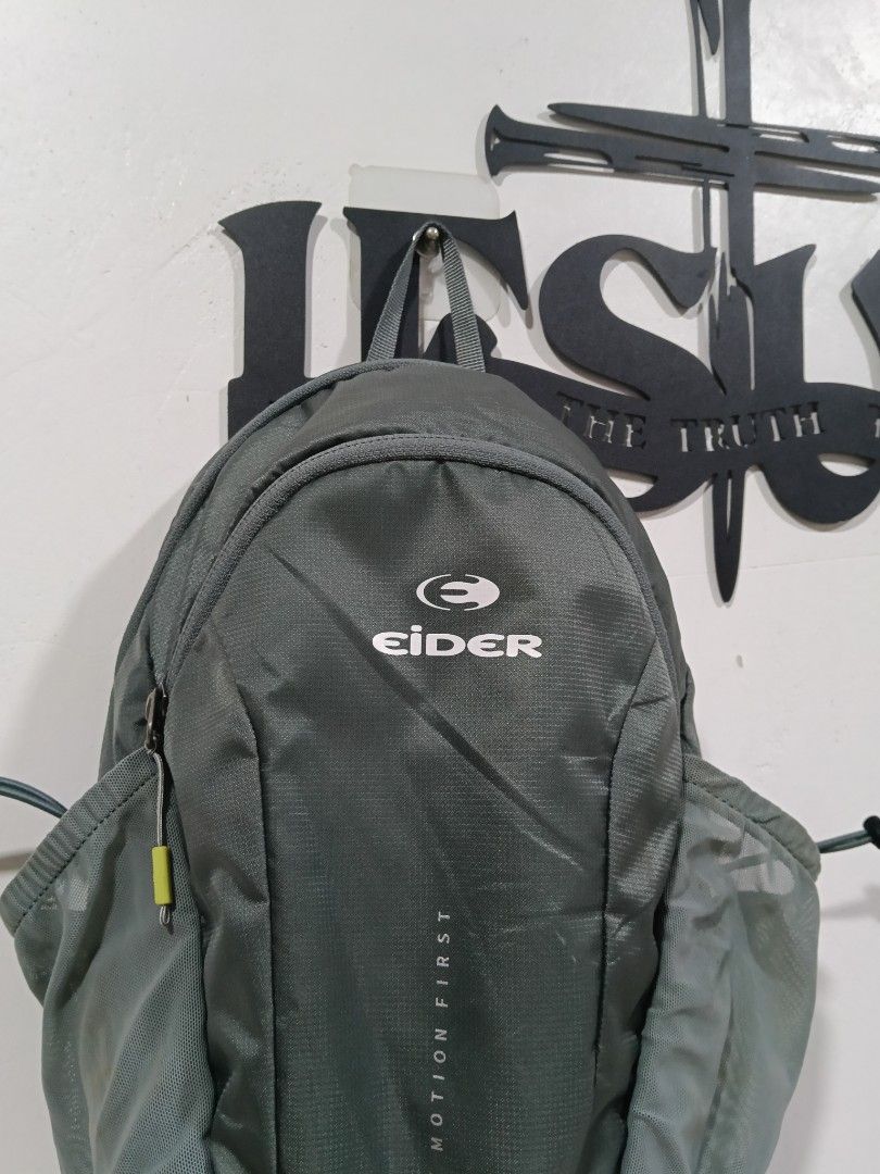 Eider Motion First Sling Backpack Gray (Category: Backpacks) located in Manila. Submitted by tristan12_13 (Listing ID 1470312789, Image 2). Description: - Brand: Eider Motion First - Color: Gray - Strap: Single padded mesh strap with adjustable buckle and D-ring clip - Back Panel: Breathable mesh with vertical YKK zippered pocket - Storage: Two side mesh pockets with adjustable bungee cord closures - Design: Large Eider logo printed on the front 