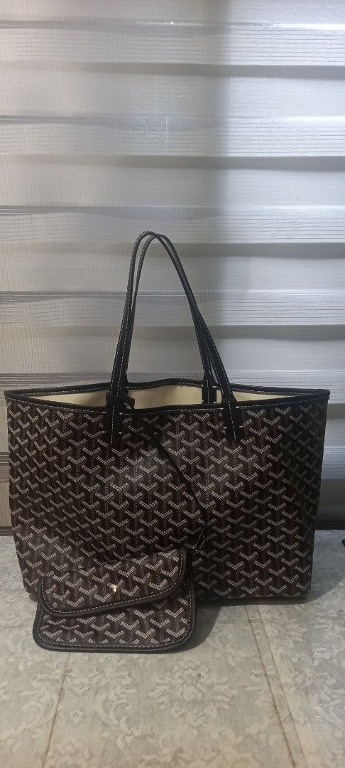 EMO Tote Bag with Pouch Brown Monogram Pattern (Category: Tote Bags) located in San Fernando. Submitted by surceeshop (Listing ID 1470217042, Image 1). Description: - Brand: EMO - Design: Brown and black chevron pattern all over - Features: Dual shoulder straps, light canvas interior lining, and clean structure - Inclusion: Matching snap-button pouch inside - Origin: Made in Korea label inside both main compartment and pouch - Condition: Roomy ev