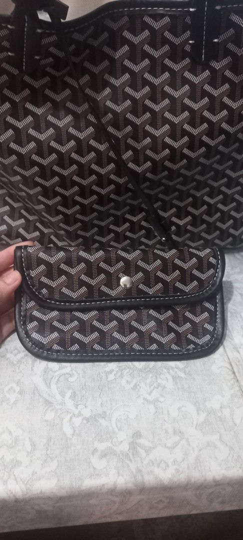 EMO Tote Bag with Pouch Brown Monogram Pattern (Category: Tote Bags) located in San Fernando. Submitted by surceeshop (Listing ID 1470217042, Image 2). Description: - Brand: EMO - Design: Brown and black chevron pattern all over - Features: Dual shoulder straps, light canvas interior lining, and clean structure - Inclusion: Matching snap-button pouch inside - Origin: Made in Korea label inside both main compartment and pouch - Condition: Roomy ev