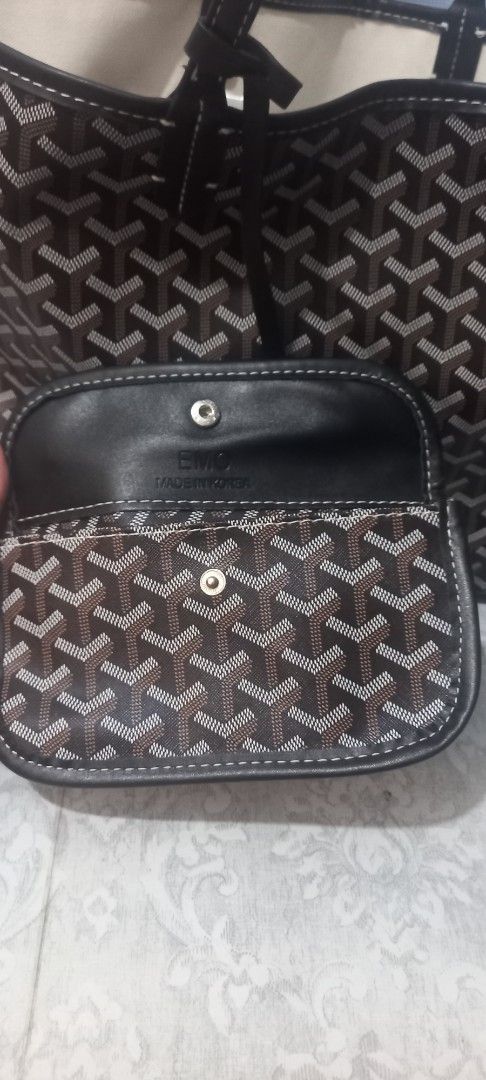 EMO Tote Bag with Pouch Brown Monogram Pattern (Category: Tote Bags) located in San Fernando. Submitted by surceeshop (Listing ID 1470217042, Image 3). Description: - Brand: EMO - Design: Brown and black chevron pattern all over - Features: Dual shoulder straps, light canvas interior lining, and clean structure - Inclusion: Matching snap-button pouch inside - Origin: Made in Korea label inside both main compartment and pouch - Condition: Roomy ev