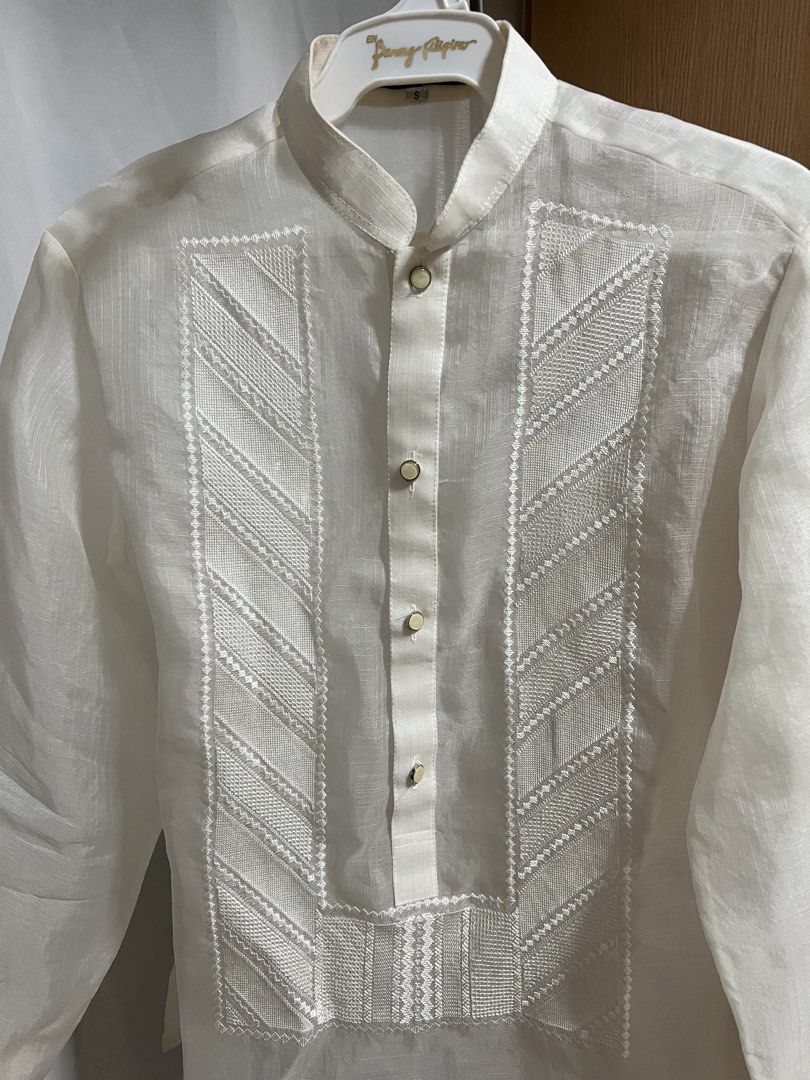 En Barong Filipino - Small (Category: Formal Shirts) located in Quezon City. Submitted by carlSELL (Listing ID 1470287181, Image 2). Description: - Authentic En Barong Filipino traditional formal shirt - Classic off-white color with intricate geometric embroidery panels - Mandarin collar style with front buttons - Long sleeves with button cuffs - Traditional sheer, clean fabric - Size: Small - Issue: General Yellowing in collar and cuffs.