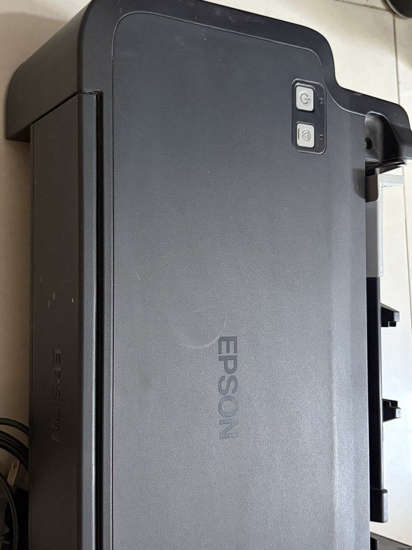 Epson L121 EcoTank Printer with Ink Bottles and Cables (Category: Printers, Scanners & Copiers) located in Manila. Submitted by piafreebee_316 (Listing ID 1470206830, Image 3). Description: Epson L121 Printer FOR SALE - well-used; gumagana pa siya but kinakain nya yung paper. kayo nalang po magpa-ayos - full inks pa, kakarefill lang; with inks authentic ink included - black, cyan, yellow, magenta (bought in national bookstore) - damage rear paper