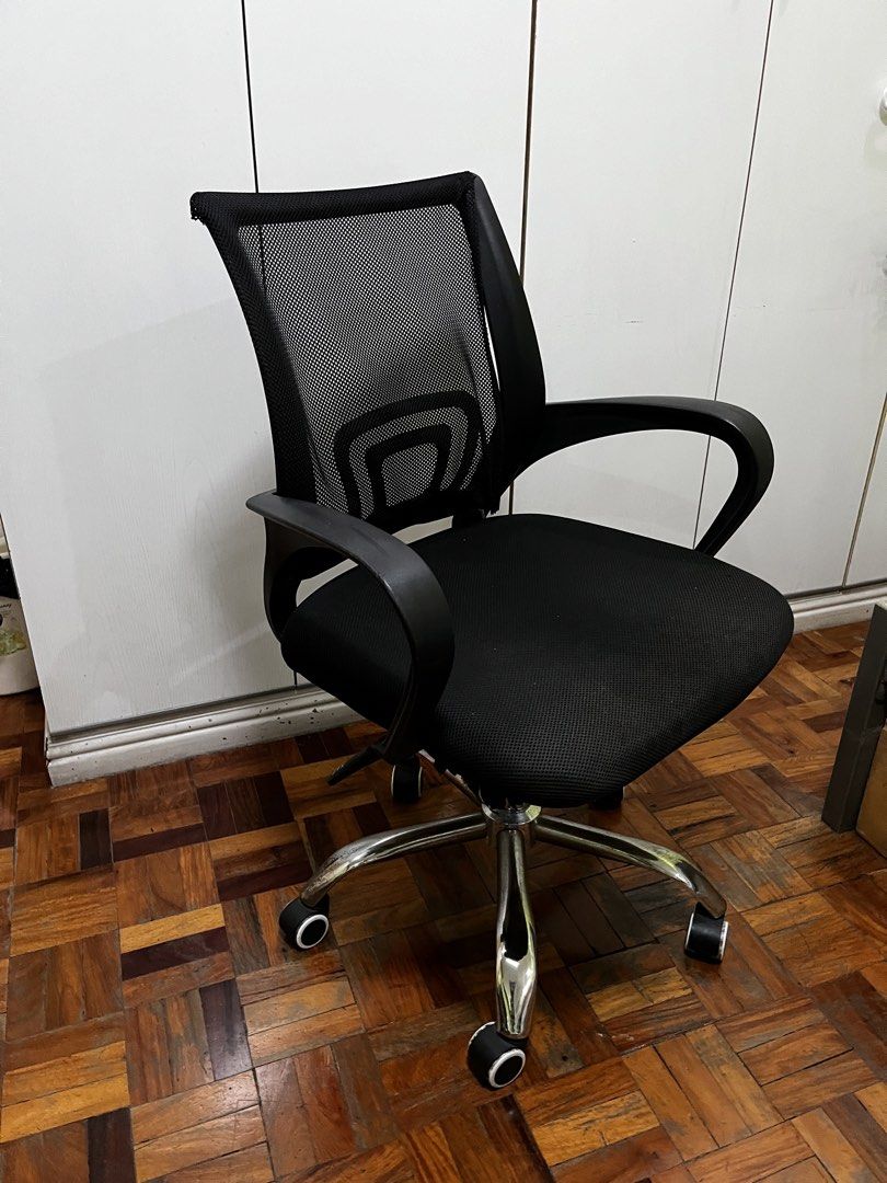 Ergonomic Mesh Office Chair (Category: Office Furniture & Fixtures) located in Mandaluyong City. Submitted by rodriguez15307 (Listing ID 1470268879, Image 1). Description: Tilt function is defective, but otherwise does the job. Other details: - Color: All black - Breathable mesh backrest to keep you cool - Comfortable padded fabric seat cushion - Sturdy chrome metal five-star base with smooth-rolling wheels - Fixed armrests for reliable support -