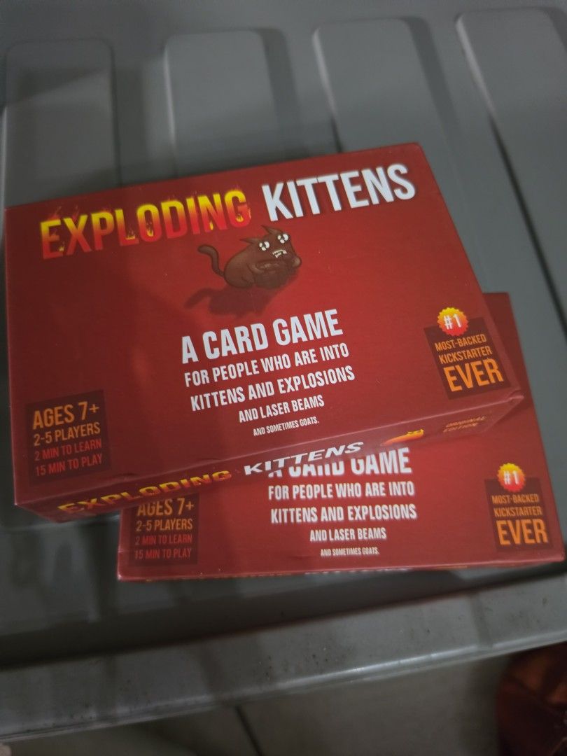 Exploding Kittens Card Game (2 pcs available) (Category: Board Games & Puzzles) located in Manila. Submitted by kimmmiii999 (Listing ID 1470146671, Image 1). Description: Exploding kittens. Used. See pics..