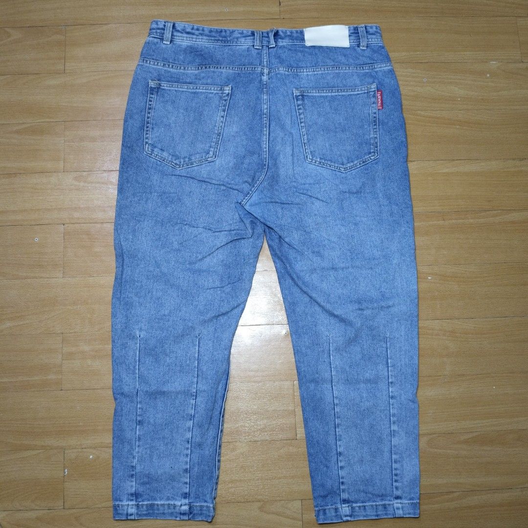 Fairwhale Blue Denim Jeans (Category: Jeans) located in Manila. Submitted by usedtobeyours26 (Listing ID 1470330041, Image 2). Description: - Brand: Fairwhale - Wash: Medium blue - Design: Classic five-pocket setup with standard belt loops - Details: Branded metal button closure and signature red pocket tag on the back - Quality: Clean stitching along seams and hems Disclaimer: Product Color May Slightly Vary Due to Photographic Lighting Sources 