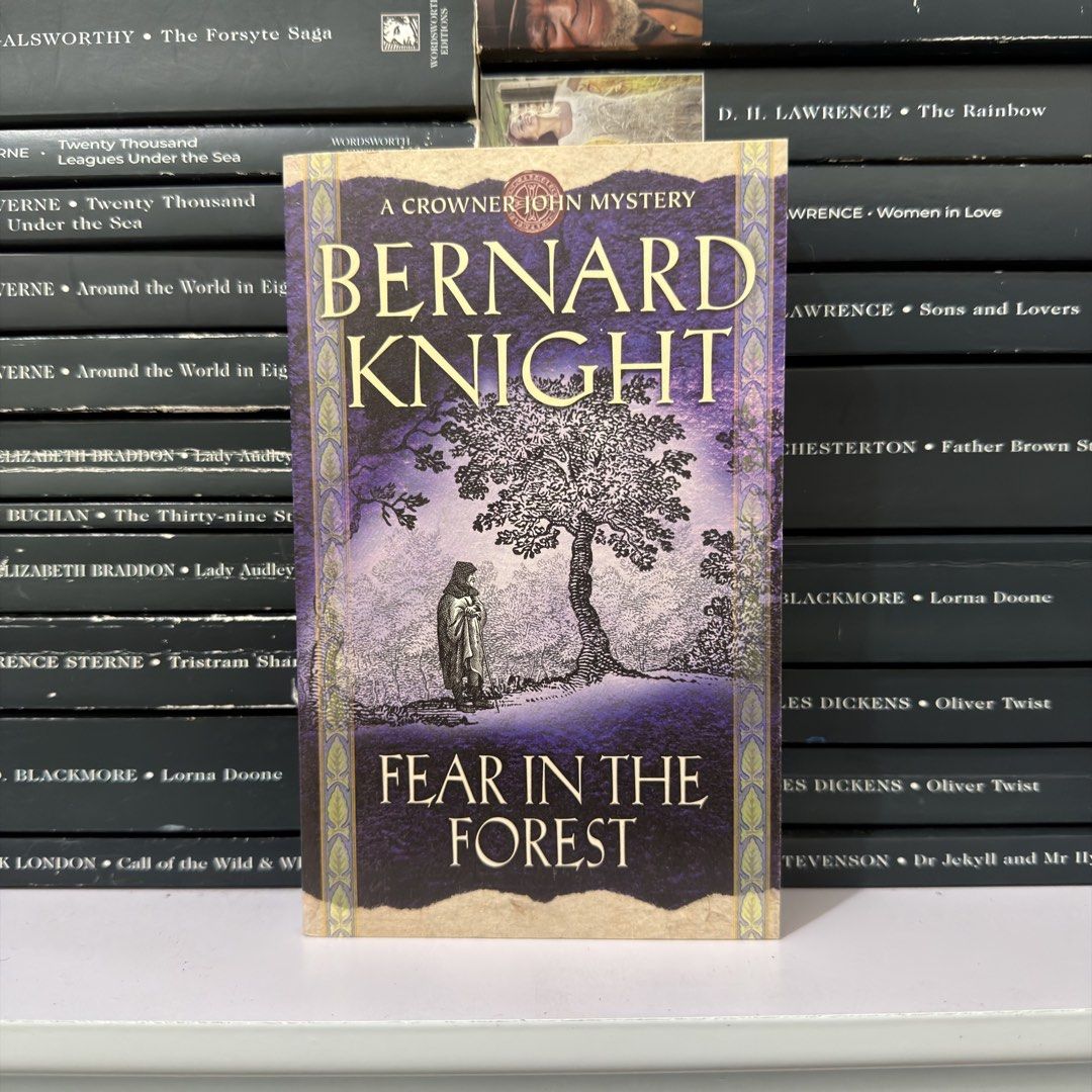 Fear In The Forest by Bernard Knight (Category: Storybooks) located in Lingayen. Submitted by readwjane (Listing ID 1470198700, Image 1). Description: - Title: Fear In The Forest (Crowner John Mystery) - Author: Bernard Knight - Format: Paperback - Cover Art: Purple and yellow design featuring a solitary figure and a large tree - Condition: Clean cover and spine, in good reading shape - Perfect for fans of historical mystery and crime fiction!.
