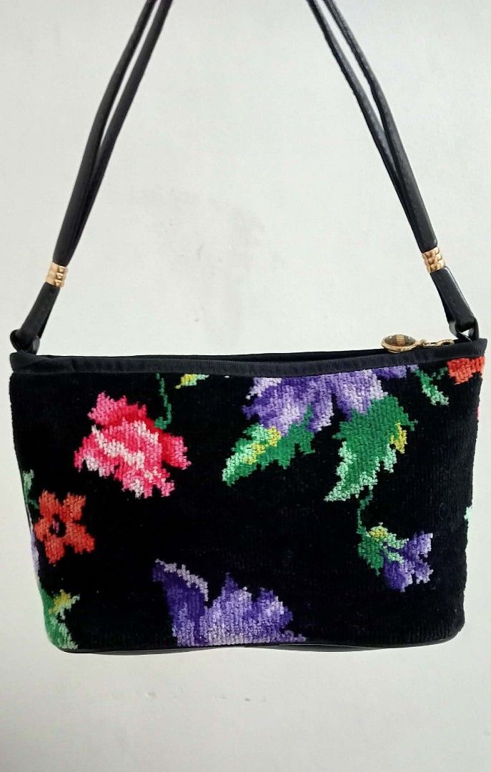 FEILER Chenille Floral Shoulder Bag (Category: Shoulder Bags) located in Siniloan. Submitted by treyyasonlineshop (Listing ID 1470152829, Image 2). Description: - Material: Soft black chenille fabric with colorful purple, pink, and green floral pattern on both sides - Strap: Black leather-like shoulder strap accented with gold-tone hardware links - Closure: Secure zip-top closure - Interior: Fabric-lined with an official brand patch - Fit: Compac