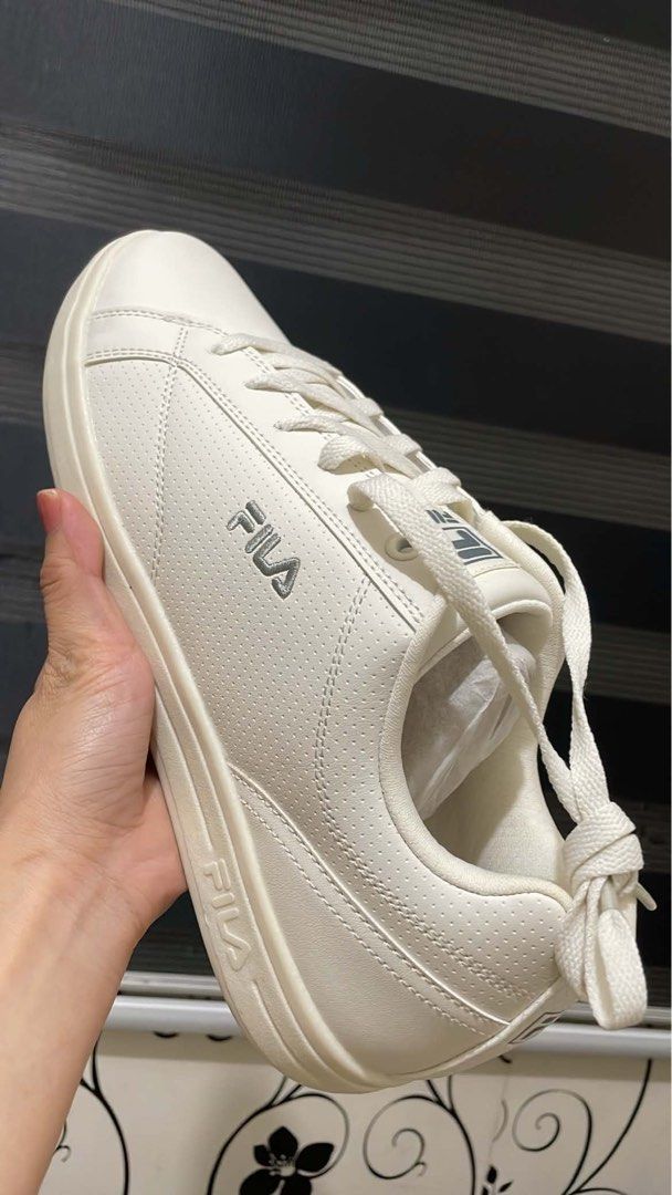Fila White Casual Sneakers (Category: Sneakers) located in Manila. Submitted by mattyinnah.14 (Listing ID 1470290307, Image 1). Description: - Brand: Fila - Condition: Brand new with tags attached (box included) - Style: Low-top casual sneakers in a clean, minimalist white design - Sole: Textured rubber sole for reliable grip - Laces: Classic flat white laces.