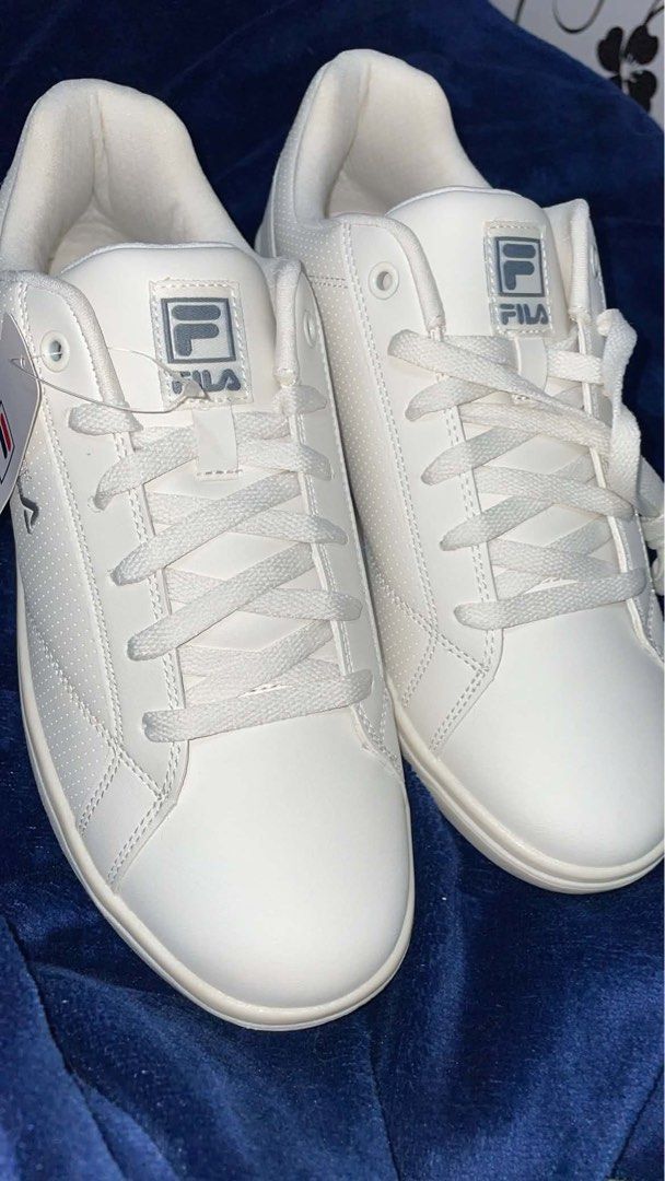 Fila White Casual Sneakers (Category: Sneakers) located in Manila. Submitted by mattyinnah.14 (Listing ID 1470290307, Image 3). Description: - Brand: Fila - Condition: Brand new with tags attached (box included) - Style: Low-top casual sneakers in a clean, minimalist white design - Sole: Textured rubber sole for reliable grip - Laces: Classic flat white laces.