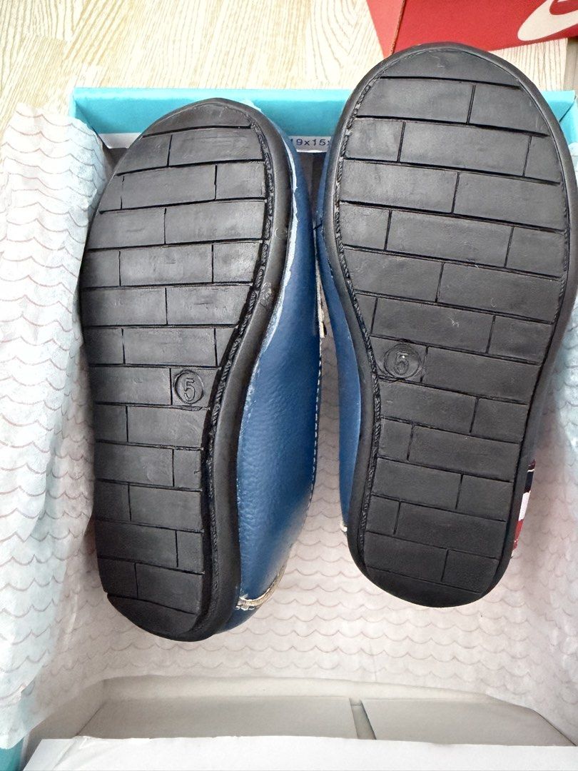 Fisher-Price Darrius Blue Loafers (Category: Babies & Kids Fashion) located in Naga. Submitted by suit_yourslf (Listing ID 1470150528, Image 2). Description: - Brand: Fisher-Price (Darrius style) - Color: Blue with red, white, and blue stripe details - Size: Toddler Size 5 - Design: Easy slip-on loafers with white contrast stitching - Inclusions: Original box included - Condition: Great for casual wear or special occasions.