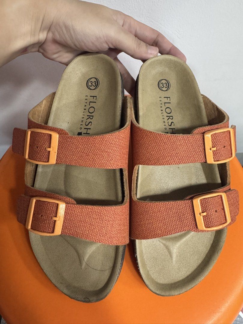 Florsheim Orange Double Buckle Sandals Size 33 (Category: Babies & Kids Fashion) located in Valenzuela. Submitted by sofiasticated.decluttering (Listing ID 1470157581, Image 2). Description: - Brand: Florsheim - Color: Vibrant orange - Size: 33 (printed on insole) - Design: Double strap with adjustable matching buckles - Footbed: Contoured cork for maximum support - Style: Casual footwear, great for everyday wear ✨ PRELOVED KIDS’ CLOTHES/SHOES✨ S