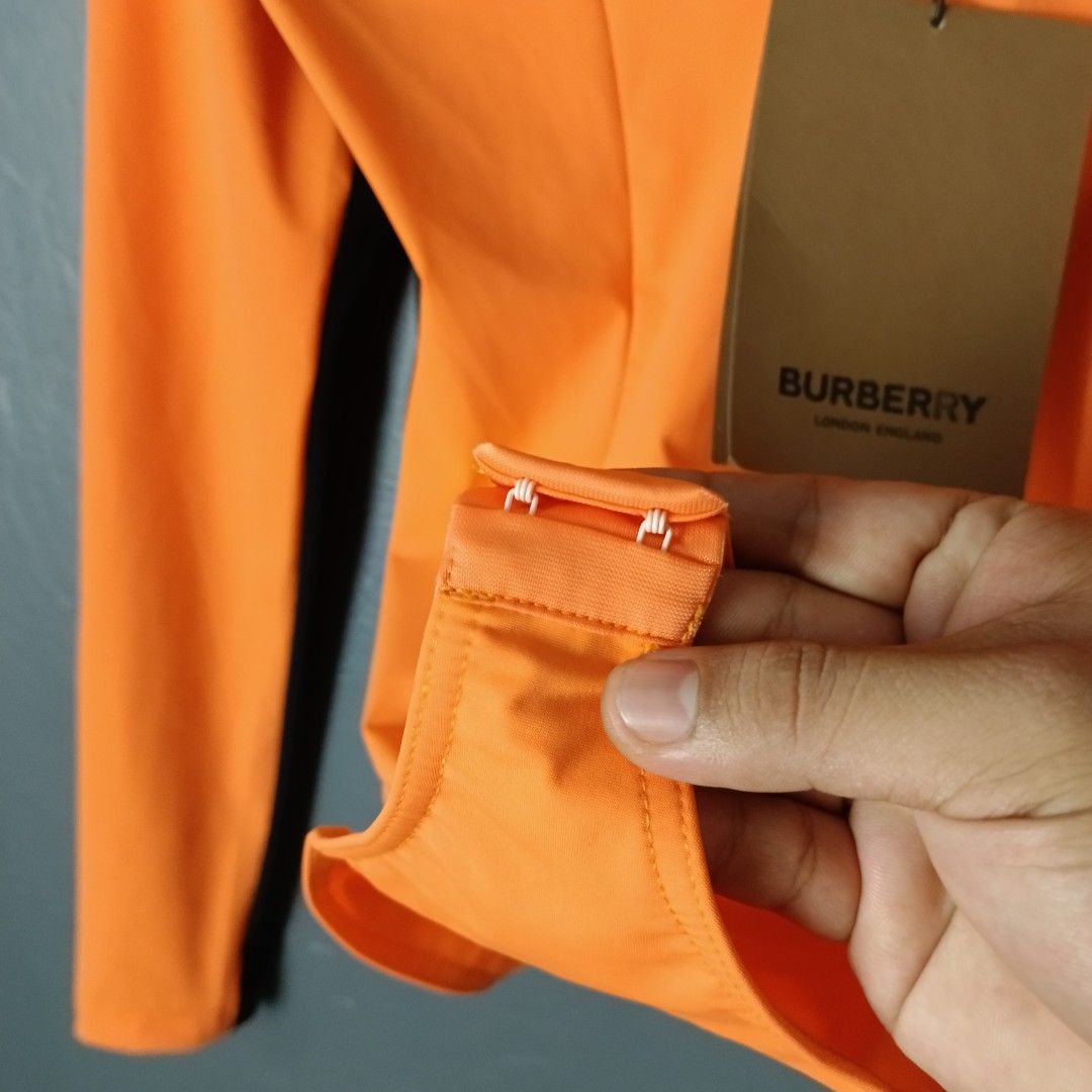 For Women - Burberry - Bodysuit (Category: Others Tops) located in Bacolod City. Submitted by drop.ph (Listing ID 1470160150, Image 3). Description: Burberry - Bright Orange Body Suit *Stretchable *Size M - 16.5x17.5 *Brand New w Tags *Minor ink stain at the back *Price: 1,800php *Add SF if outside Bacolod City.