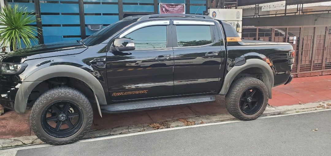 Ford Ranger (Category: Used Cars) located in Marikina City. Submitted by brightlion.8fc40a (Listing ID 1470241461, Image 2). Description: 🚘 FOR SALE: 2022 Ford Ranger Wildtrak 4x2 - AT Mileage: 22,000+ km Color: Black Coding: Tuesday First owner | Casa-maintained No Internal/External issues, 100% flood free or never involved in an accident (check w/ LTO) Inclusions & Upgrades: Roller lid manual, Pickup truck tailgate adjustable ladder, 3 pcs rub