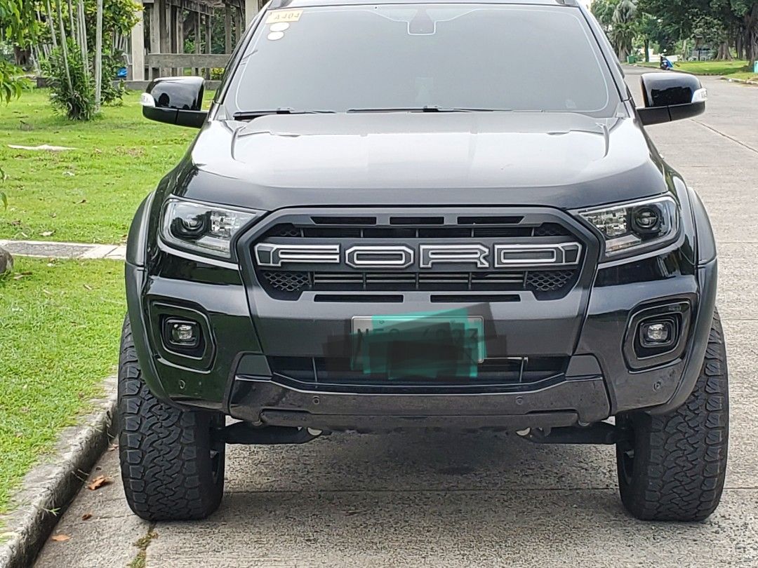 Ford Ranger (Category: Used Cars) located in Marikina City. Submitted by brightlion.8fc40a (Listing ID 1470241461, Image 1). Description: 🚘 FOR SALE: 2022 Ford Ranger Wildtrak 4x2 - AT Mileage: 22,000+ km Color: Black Coding: Tuesday First owner | Casa-maintained No Internal/External issues, 100% flood free or never involved in an accident (check w/ LTO) Inclusions & Upgrades: Roller lid manual, Pickup truck tailgate adjustable ladder, 3 pcs rub