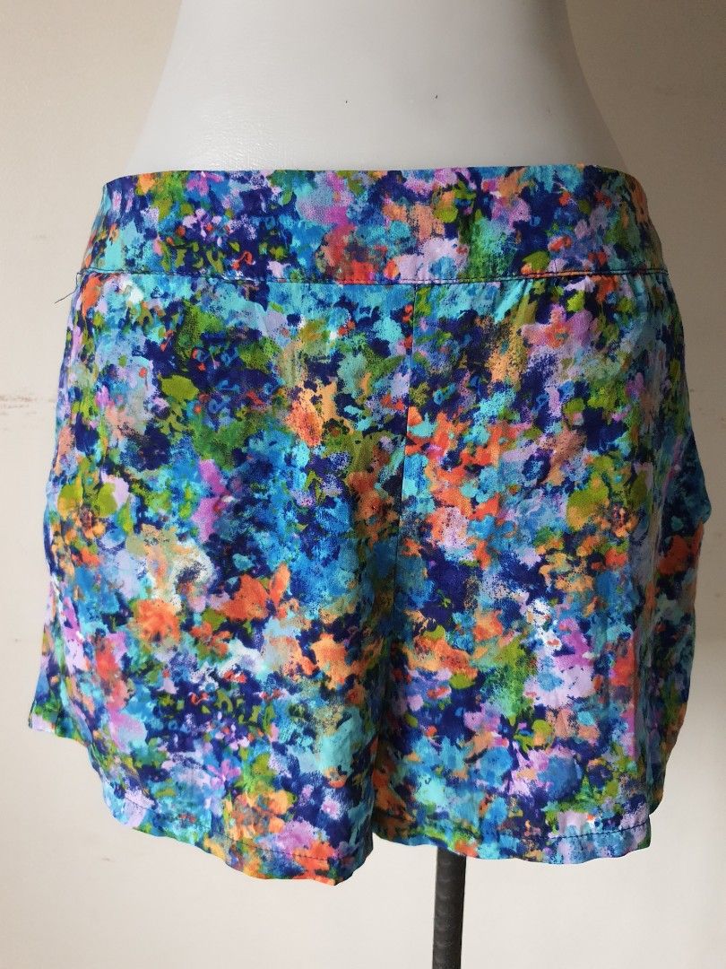 Forever 21 Floral Print Shorts Size M (Category: Shorts) located in Meycauayan. Submitted by shoptoown (Listing ID 1470177654, Image 1). Description: - Brand: Forever 21 - Size: M (Made in Vietnam) - Design: Vibrant floral print (Blue, Green, Orange, Purple) with solid blue lining - Measurements: Waist ~15 inches across, Length ~13 inches - Condition/Features: Comfortable casual fit, lightweight and perfect for warm weather.