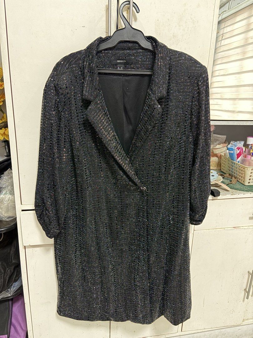 Forever 21 Plus Black Sequin Blazer Jacket Size 2X (Category: Coats, Jackets and Outerwear) located in Pateros City. Submitted by selleysells (Listing ID 1470242906, Image 1). Description: - Brand: Forever 21 Plus - Size: 2X - Color: Black with sparkling sequin fabric - Design: Structured lapels and front button closure - Comfort: Fully lined interior - Style Tip: Great statement piece for parties, nights out, or dressing up casual looks.