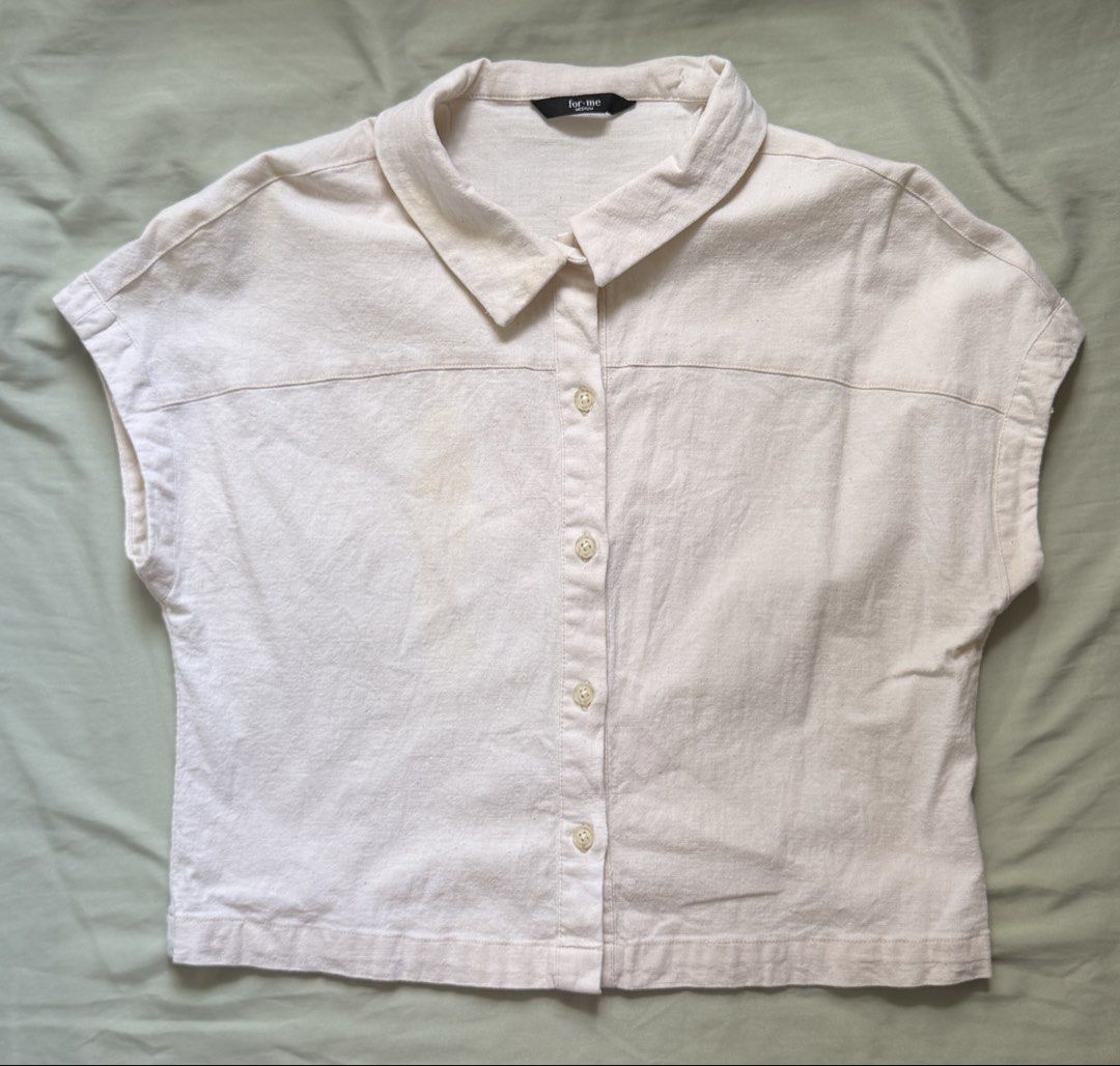 ForMe Cream Short Sleeve Button-Up Collar Top Medium (Category: Blouses) located in Dinalupihan. Submitted by wonmeoww (Listing ID 1470251071, Image 1). Description: - Brand/Style: ForMe cream button-up top - Size: Medium - Features: Classic collar, short cap sleeves, textured cotton fabric, slightly cropped length, matching front buttons - Flaws: Visible yellowish stains (needs to be washed since it was stocked).