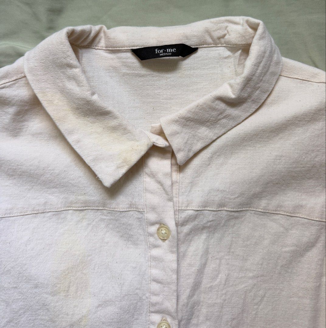 ForMe Cream Short Sleeve Button-Up Collar Top Medium (Category: Blouses) located in Dinalupihan. Submitted by wonmeoww (Listing ID 1470251071, Image 3). Description: - Brand/Style: ForMe cream button-up top - Size: Medium - Features: Classic collar, short cap sleeves, textured cotton fabric, slightly cropped length, matching front buttons - Flaws: Visible yellowish stains (needs to be washed since it was stocked).