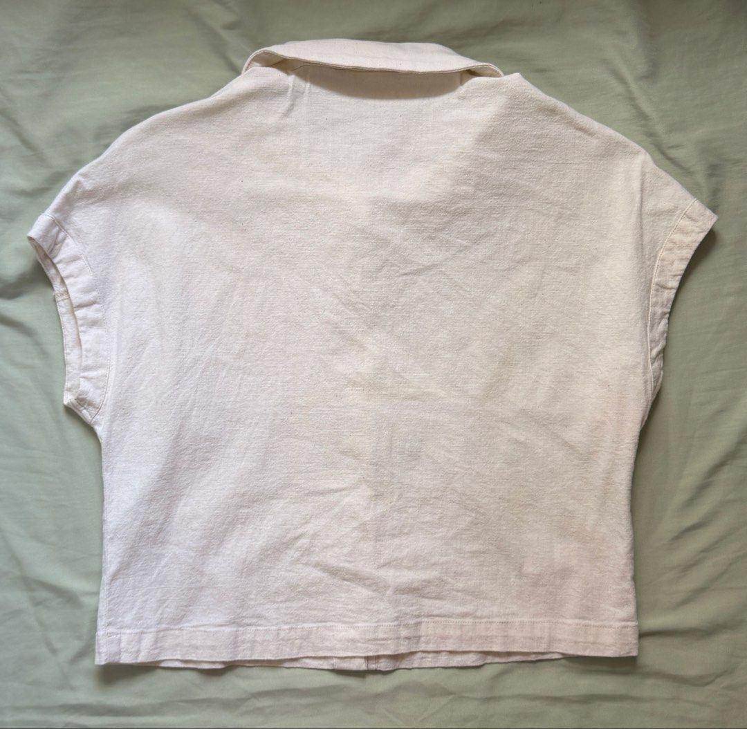 ForMe Cream Short Sleeve Button-Up Collar Top Medium (Category: Blouses) located in Dinalupihan. Submitted by wonmeoww (Listing ID 1470251071, Image 2). Description: - Brand/Style: ForMe cream button-up top - Size: Medium - Features: Classic collar, short cap sleeves, textured cotton fabric, slightly cropped length, matching front buttons - Flaws: Visible yellowish stains (needs to be washed since it was stocked).