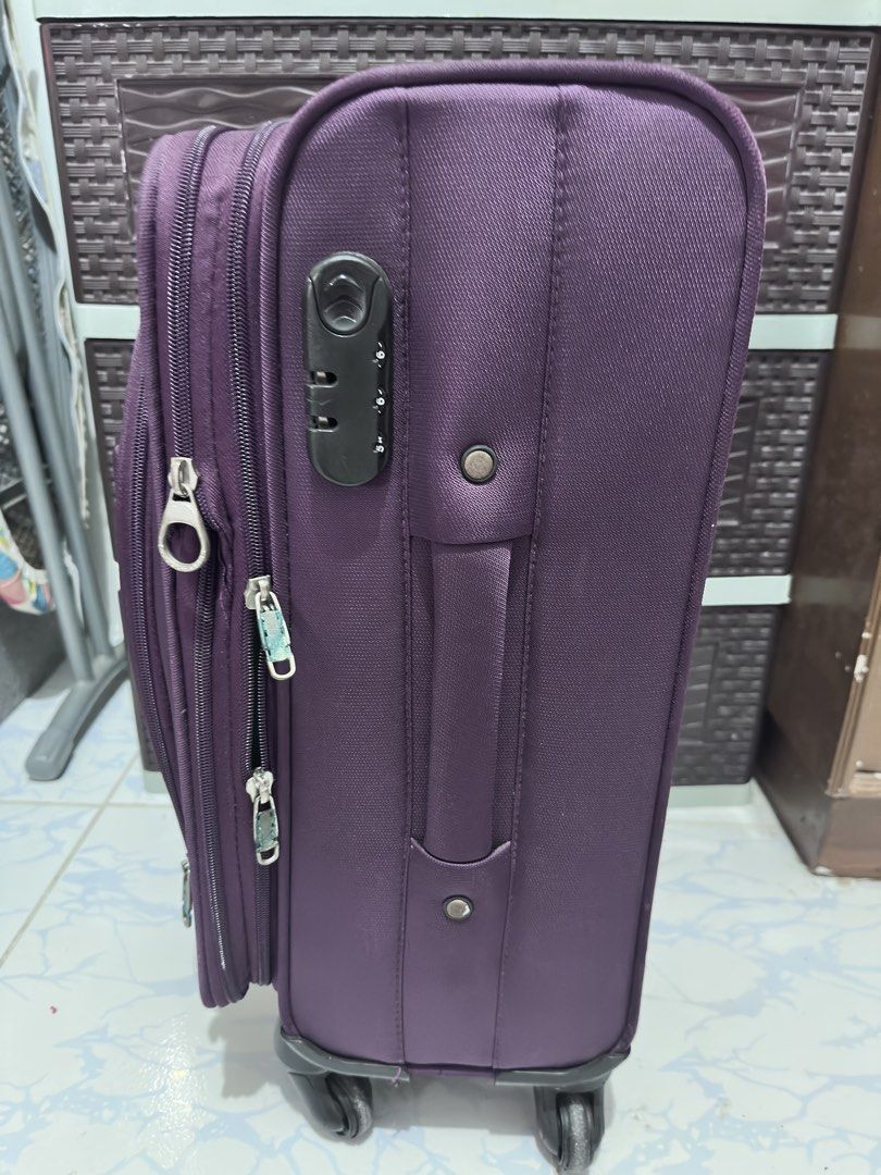 Forthpack Purple Luggage Suitcase Rolling Bag (Category: Luggage) located in Malolos. Submitted by sam.sam10 (Listing ID 1470218162, Image 2). Description: - Brand: Forthpack - Color: Purple - Features: Smooth-rolling wheels, retractable handle, and built-in side combination lock - Storage: Multiple secure zipper compartments and convenient front pockets - Handles: Top and side carry handles for easy lifting - Condition: Good working condition wi
