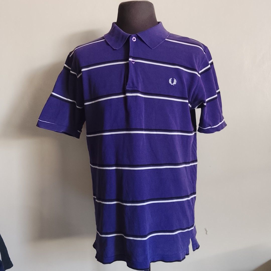 Fred Perry - Purple Stripe Polo Shirt (Category: Luxury Apparel) located in Angeles City. Submitted by sselects_ (Listing ID 1470157996, Image 1). Description: Details of the item: *Color may vary due to lighting Size: M on tag Width: 20" Length: 28" Issue: sign of usage as seen on photos Condition: Good ALL ITEMS ARE NEGOTIABLE.