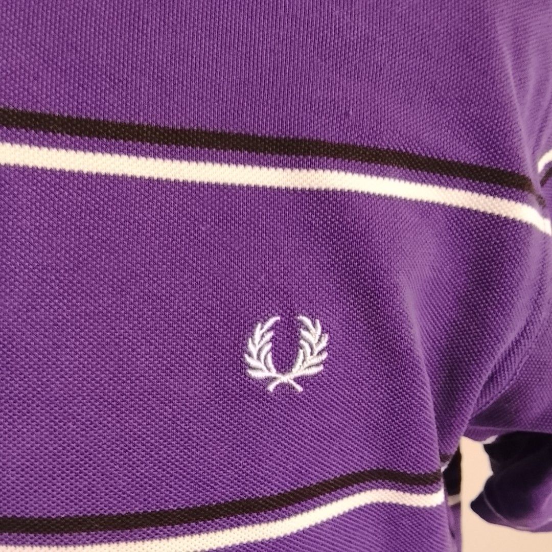 Fred Perry - Purple Stripe Polo Shirt (Category: Luxury Apparel) located in Angeles City. Submitted by sselects_ (Listing ID 1470157996, Image 2). Description: Details of the item: *Color may vary due to lighting Size: M on tag Width: 20" Length: 28" Issue: sign of usage as seen on photos Condition: Good ALL ITEMS ARE NEGOTIABLE.