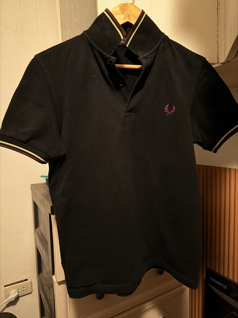 Fred Perry Black Polo Shirt (Category: Tshirts & Polo Shirts ) located in Caloocan City. Submitted by almrjsry24124 (Listing ID 1470315306, Image 1). Description: - Brand: Fred Perry (Model M3600) - Color: Black with pink tipped collar and cuffs - Details: Pink embroidered laurel wreath logo, two-button placket with branded buttons - Material: Clean cotton pique, made in China - Condition: Excellent, ready to wear - Mode of Payment: GCash, BPI, o