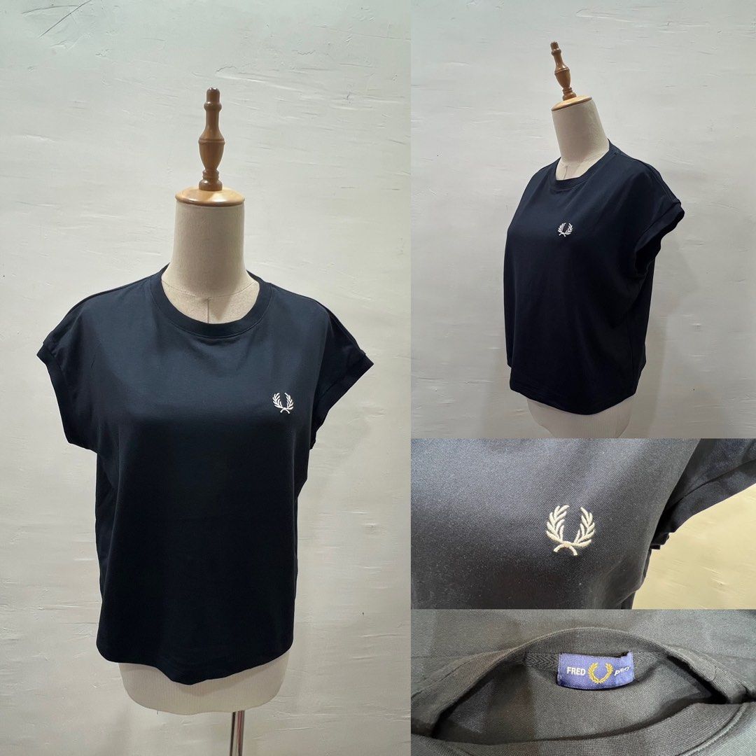 Fred Perry Black Short Sleeve T-Shirt (Category: Tshirts & Polo Shirts ) located in Bacolod City. Submitted by bhabissagal-05763 (Listing ID 1470288477, Image 1). Description: - Brand: Fred Perry - Color: Black - Logo: Signature embroidered laurel wreath on the chest - Design: Classic crew neck and short cap sleeves - Material: Comfortable, high-quality cotton - Condition: Great everyday basic top.
