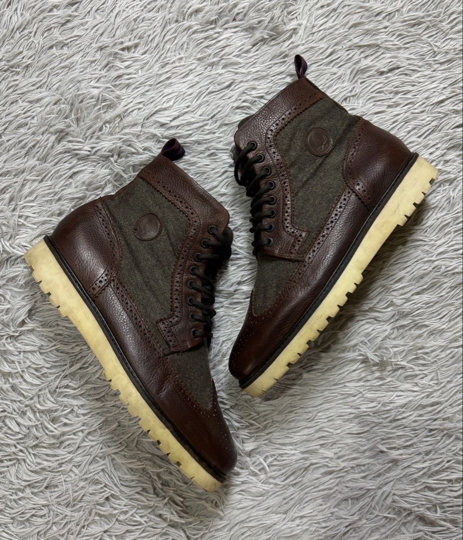 Fred Perry Men’s NorthGate Leather Boots sz 9 (Category: Boots) located in Dipolog. Submitted by krstnagnis98 (Listing ID 1470221519, Image 3). Description: Fred Perry Men’s Northgate Leather Boots These are Fred Perry Men’s Leather/Wool Brogue boots a hybrid upper featuring premium dark brown leather paneling combined with forest green wool/tweed inserts along the sides and tongue. Brogue Detailing: Classic wingtip perforation accents detailing 