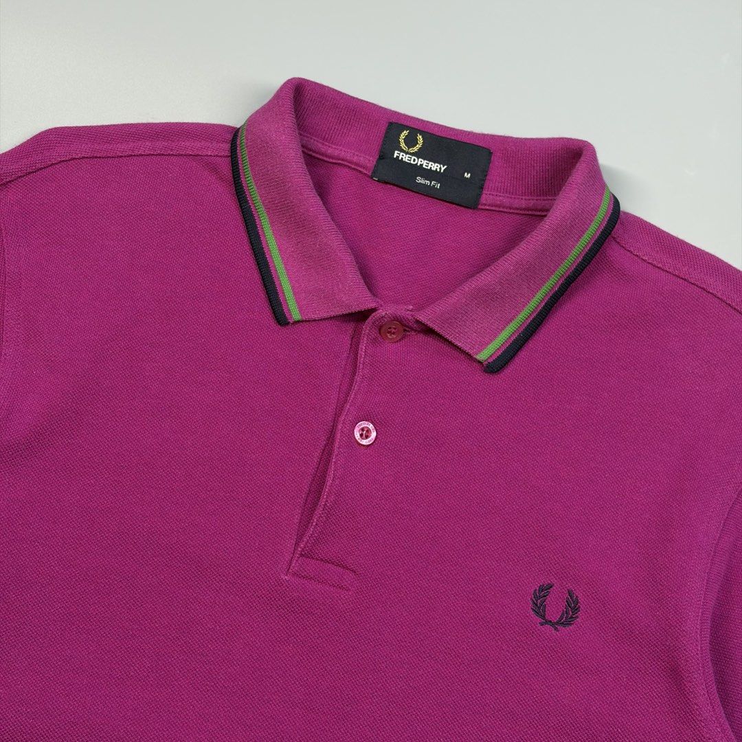 Fred Perry Twin Tipped (Authentic) (Category: Luxury Apparel) located in Cavite. Submitted by onebeancent (Listing ID 1470344936, Image 2). Description: Size: Medium (Men) | Large to XL (Women's) Dimension: 19" Width | 27" Length Color: Magenta Purple Color Rate: 9.5/10 Issue: None Condition: Excellent Price: 980php Additional Shipping Fee (J&T Small Pouch) 75php Luzon 100php visayas 120php mindanao.