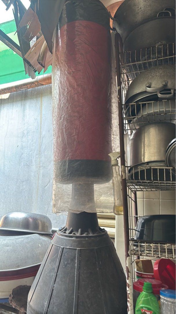Freestanding Punching Bag with Heavy Base (Category: Combat Sports) located in Quezon City. Submitted by ricalazo (Listing ID 1470179055, Image 1). Description: - Type: Standing punching bag - Color: Red and black - Base: Plastic (fillable with water or sand for maximum stability) - Condition: Good condition lightly used, wrapped in protective plastic - Ideal for: Home training, boxing, and martial arts practice - Build: Sturdy and durable for he
