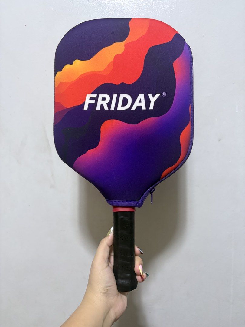 Friday Aura Pro Pickleball Paddle (Category: Racket and Ball Sports) located in Rizal. Submitted by prelovedgail (Listing ID 1470159082, Image 2). Description: FRIDAY AURA PRO DINKLAB 1/100 pcs released 1 month used only pls see photos for ur reference - Model: Friday Aura Pro (Gen IV) - Design: Black surface with striking orange and yellow tiger stripe graphics - Protection: Premium red metallic edge guard all around - Handle: Comfortable black 