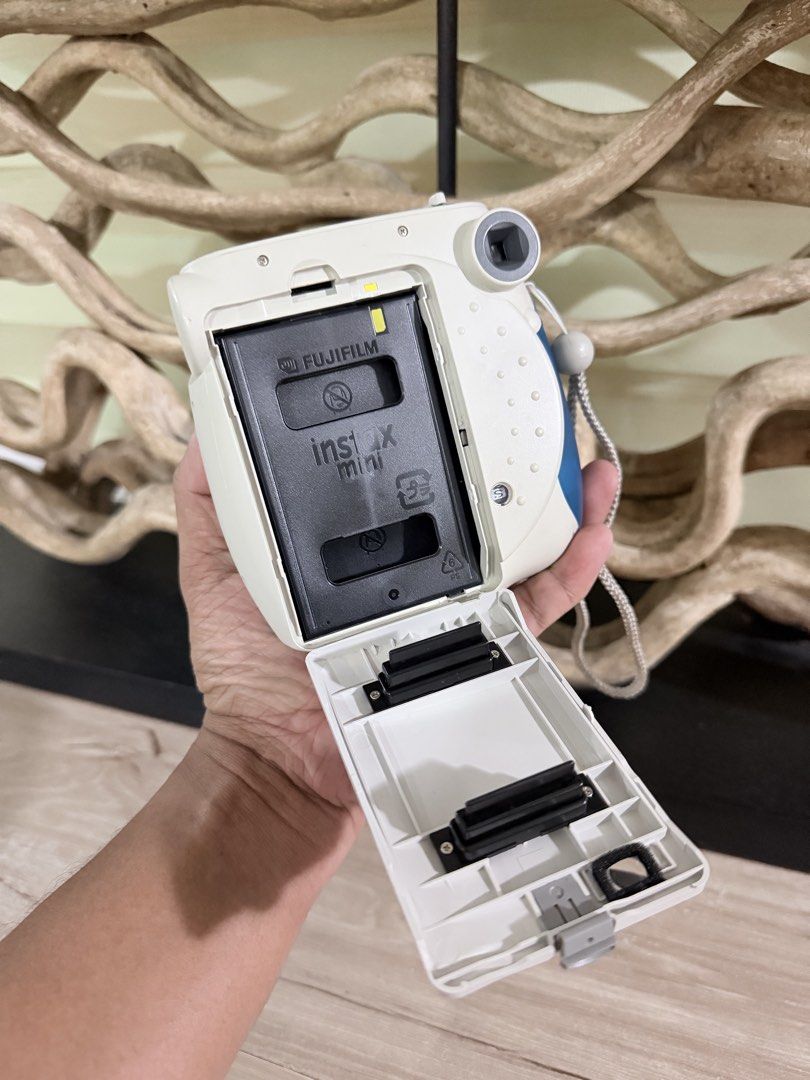 Fujifilm Instax Mini 7S (Category: Cameras) located in Pasig City. Submitted by iambernabe (Listing ID 1470349159, Image 3). Description: - Model: Fujifilm Instax Mini instant camera - Condition: Excellent, clean battery compartment (uses AA batteries) - Features: Smooth film door mechanism, ready to use - Inclusions: Original hand strap - Perfect for: Vacations, parties, and everyday memories.