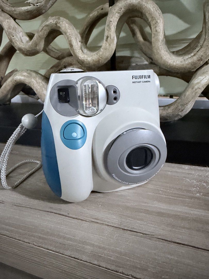 Fujifilm Instax Mini 7S (Category: Cameras) located in Pasig City. Submitted by iambernabe (Listing ID 1470349159, Image 2). Description: - Model: Fujifilm Instax Mini instant camera - Condition: Excellent, clean battery compartment (uses AA batteries) - Features: Smooth film door mechanism, ready to use - Inclusions: Original hand strap - Perfect for: Vacations, parties, and everyday memories.