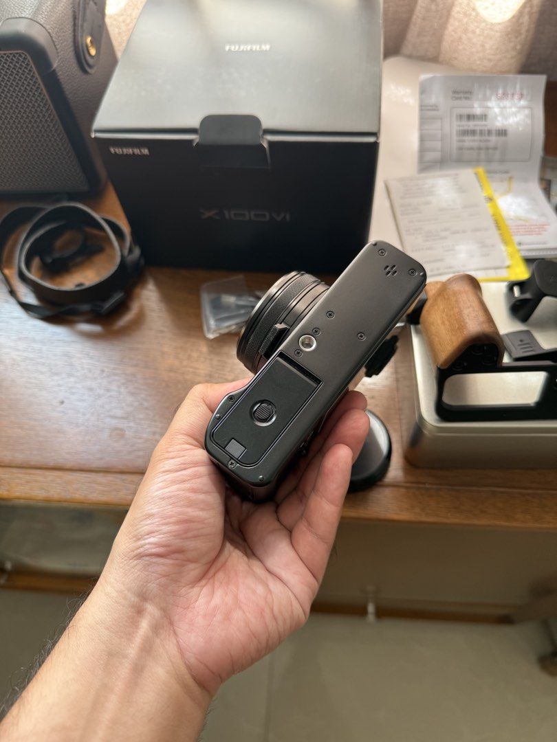 Fujifilm X100VI (Category: Cameras) located in Lipa City. Submitted by tunying24 (Listing ID 1470174014, Image 3). Description: Fujifilm X100VI Black Noir (2,700 clicks only) 🔺 Complete package - Original box and papers - Original receipt (Bought Locally from Photoline) 11 months old - Original unused cable - Original fujifilm neck lanyard 🔺 Camera is in good condition, has minor dent on sides. But can be covered by the L Plate or the free JJC 