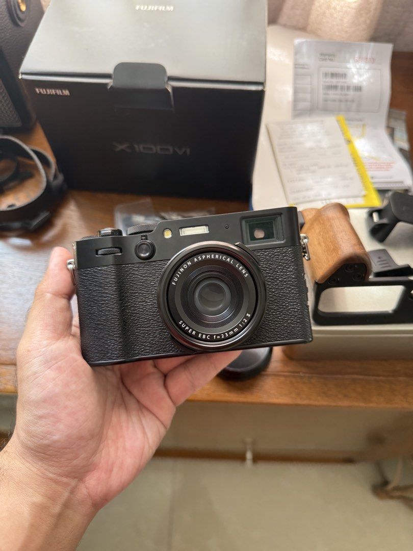 Fujifilm X100VI (Category: Cameras) located in Lipa City. Submitted by tunying24 (Listing ID 1470174014, Image 2). Description: Fujifilm X100VI Black Noir (2,700 clicks only) 🔺 Complete package - Original box and papers - Original receipt (Bought Locally from Photoline) 11 months old - Original unused cable - Original fujifilm neck lanyard 🔺 Camera is in good condition, has minor dent on sides. But can be covered by the L Plate or the free JJC 
