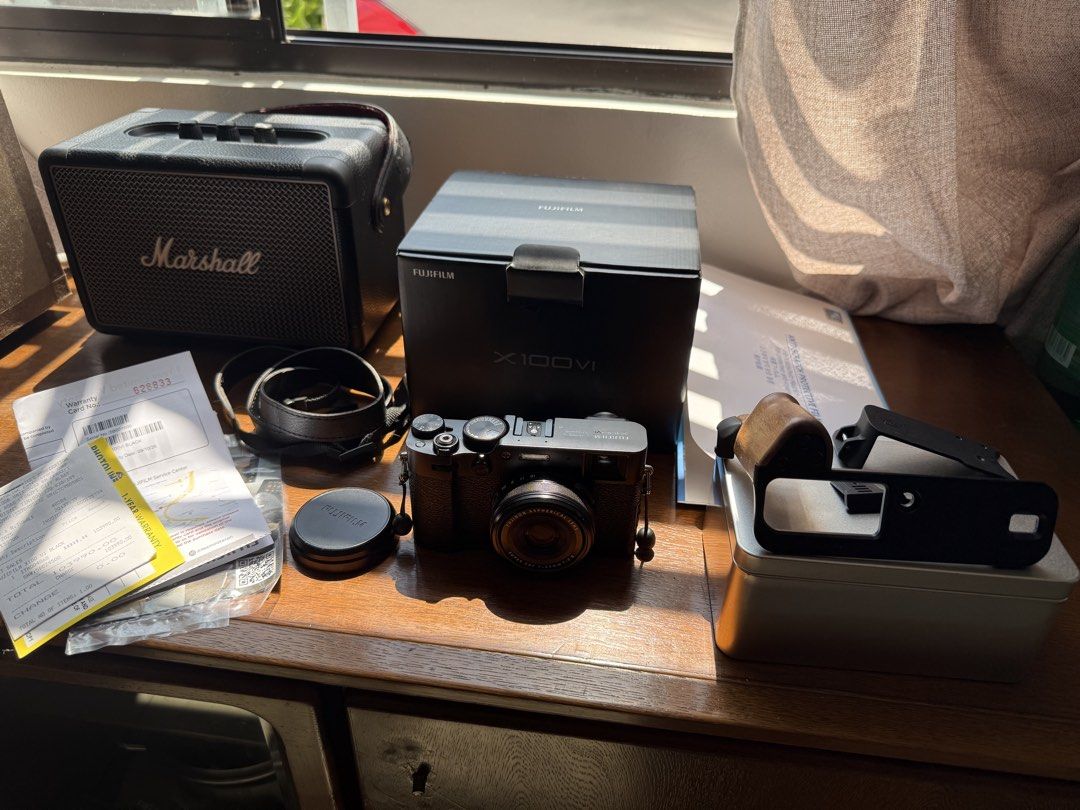 Fujifilm X100VI (Category: Cameras) located in Lipa City. Submitted by tunying24 (Listing ID 1470174014, Image 1). Description: Fujifilm X100VI Black Noir (2,700 clicks only) 🔺 Complete package - Original box and papers - Original receipt (Bought Locally from Photoline) 11 months old - Original unused cable - Original fujifilm neck lanyard 🔺 Camera is in good condition, has minor dent on sides. But can be covered by the L Plate or the free JJC 