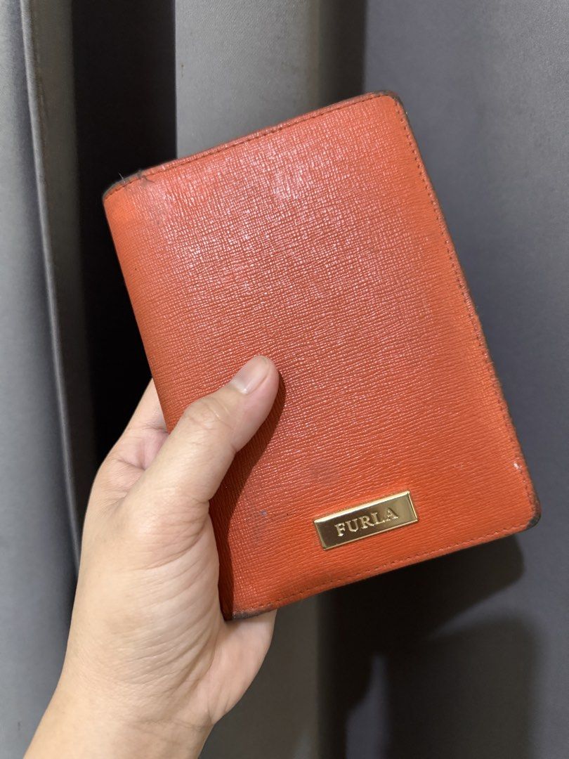 Furla bifold wallet (Category: Luxury Bags & Wallets) located in Manila. Submitted by mikmmmmik (Listing ID 1470152939, Image 1). Description: Furla bifold wallet. Can be used as a passport holder. 100% authentic. Price is negotiable. Complete with box, dustbag, and care card..