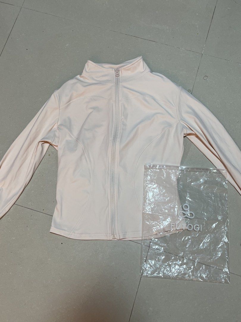 FUYOGI Light Pink Full Zip Yoga Jacket (Category: Coats, Jackets and Outerwear) located in Guiguinto. Submitted by junibunn (Listing ID 1470348839, Image 1). Description: - Color: Light pink - Style: Full zip front with a chic high collar and long sleeves - Fit: Contoured seam details designed to flatter the torso - Material: Soft, stretchy, and comfortable athletic fabric - Condition: Brand new, includes original clear plastic FLAYOGI packaging 