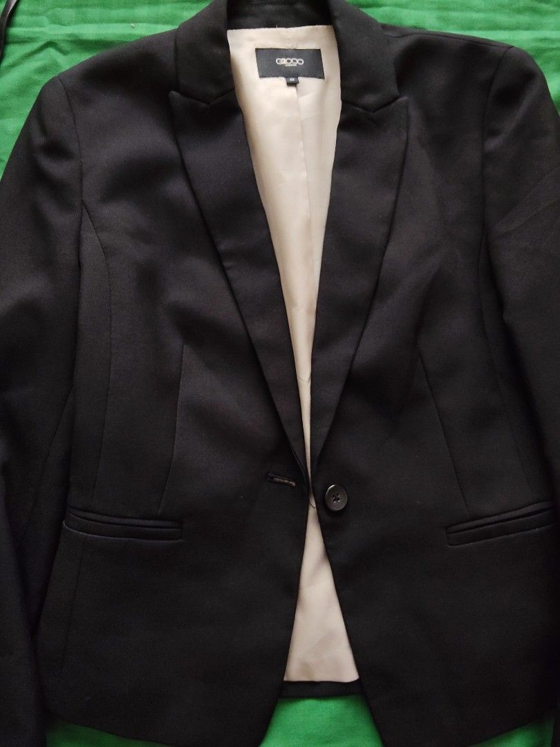 G2000 Woman Black Blazer Size 32 (Category: Coats, Jackets and Outerwear) located in Batangas. Submitted by ms.d_preloveditems (Listing ID 1470213087, Image 3). Description: - Brand: G2000 Woman - Color: Black with light beige lining - Size: 32 (Tag on collar) - Material: 100% Polyester - Closure: Single front button - Pockets: Two front pockets with flaps - Style: Professional, corporate, formal - Condition: Excellent pre-loved condition -ready 