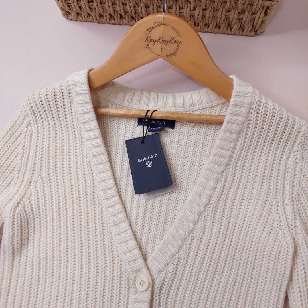 Gant Cream Knit Cardigan (Category: Babies & Kids Fashion) located in Subic. Submitted by kukay0521 (Listing ID 1470166177, Image 2). Description: - Brand: Gant - Color: Cream - Style: Knit cardigan with ribbed texture, front button closure, and two front pockets - Material: Super cozy and stretchy fabric - Size: Tagged 5-6 y/o, fits up to 6-7 y/o - Measurements: 19 inches length x 13 inches width - Code: J18.