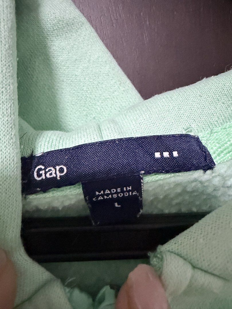 Gap Mint Green Zip Up Hoodie (Category: Coats, Jackets and Outerwear) located in Las Pinas. Submitted by ml.closet (Listing ID 1470314380, Image 3). Description: Has a hole by the pocket. Pls see pic.