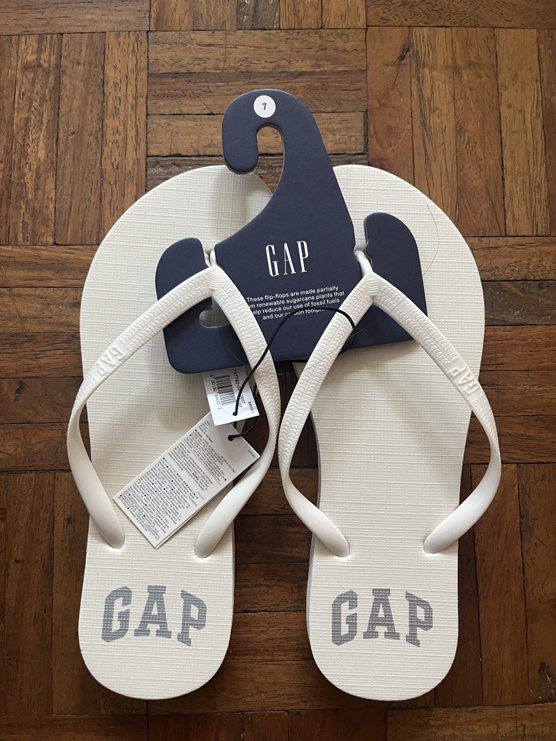 GAP White Flip-Flops Size 7 (Category: Slippers and slides) located in Makati City. Submitted by yoursecondbest (Listing ID 1470156948, Image 1). Description: - Brand: GAP - Item: White flip-flops - Size: 7 - Material: Made partially from renewable sugarcane plants - Features: Textured footbed with GAP logo and thick straps with embossed GAP branding - Condition: Brand new with original store tags and hanger attached - Ideal for: Casual beach day