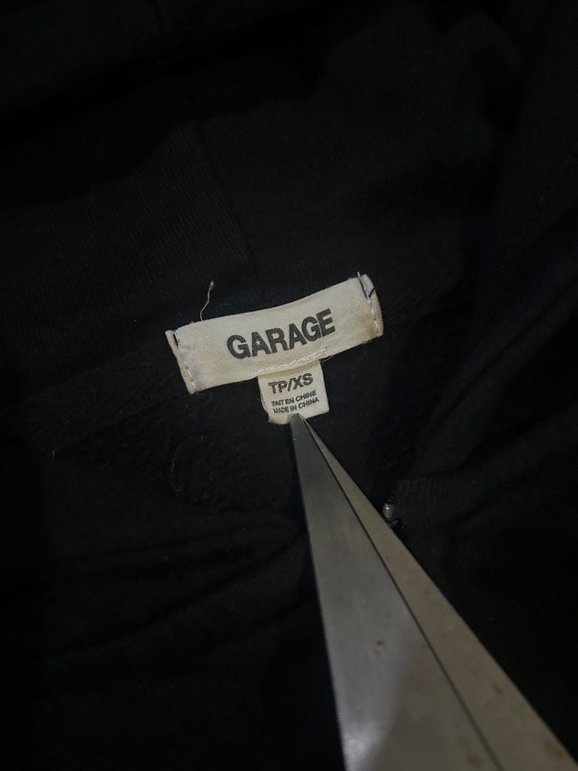 Garage Black Zip-Up Hoodie (Category: Coats, Jackets and Outerwear) located in San Fernando. Submitted by thrift_lang_ni_kim (Listing ID 1470263013, Image 3). Description: ⬇️ DETAILS ⬇️ Garage Black Zip-Up Hoodie DIMENSIONS (INCHES) Width:22 Length:26 Best fit: L to XL (short fit) Color rate:9/10 Condition/Issue:Good condi / minimal white dot stain Mine: ₱350 Minimum increment: ₱50 Already washed and ready to wear. 📌 Please check all photos care