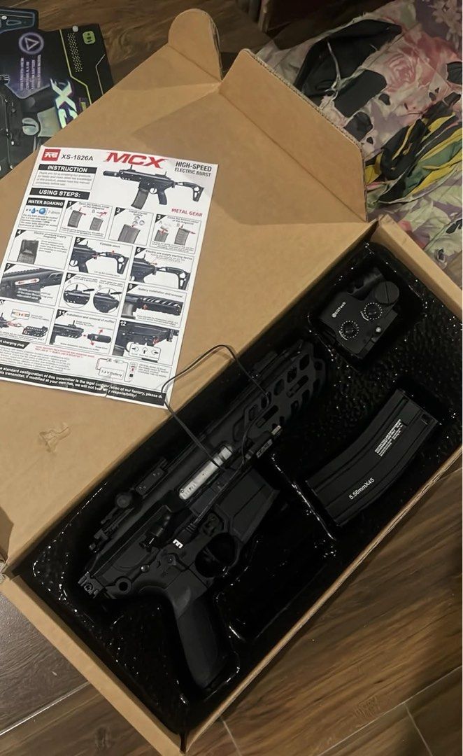 GelBlaster tg mcx complete set (Category: Action & Battle Toys) located in Caloocan City. Submitted by crucifiedtearz (Listing ID 1470279268, Image 3). Description: - Model: MCX XS-1826A gel bead blaster with metal gear setup - Condition: Like new, tested once and packed back in original molded box - Ammo: Shoots 7-8mm water beads via high-speed electric burst - Accessories included: Detachable 5.56mmX45 magazine, tactical red dot sight, and fold