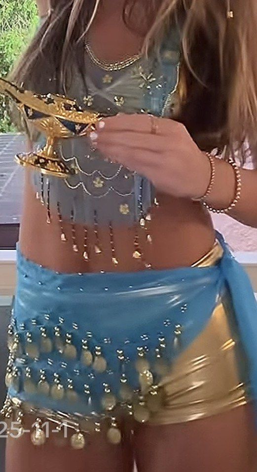 GENIE HALLOWEEN COSTUME (Category: Sets or Coordinates) located in Manila. Submitted by littlebowtique (Listing ID 1470154975, Image 1). Description: Genie halloween costume for sale! Inclusions: head accessory blue veil waist chain gold bra gold shorts can fit xxs-s.