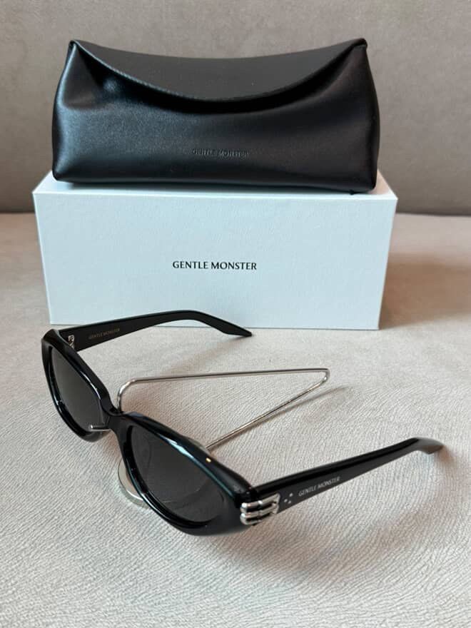 Gentle Monster Sunglasses Black with Case (Category: Sunglasses & Eyewear) located in Caloocan City. Submitted by izzie_finds (Listing ID 1470189636, Image 2). Description: - Brand: Gentle Monster - Color: Black with unique metal bridge detail and temple branding - Condition: Brand new, unworn, pristine shape - Lenses: Clear with zero scratches - Inclusions: Original white box and black leatherette case.